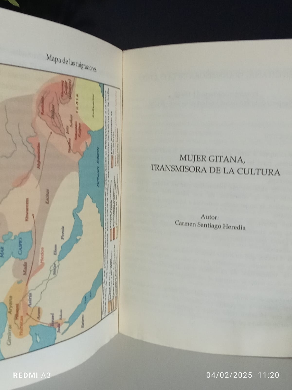 Open publication showing a migration map and the title Woman Roma, Transmitter of Culture
